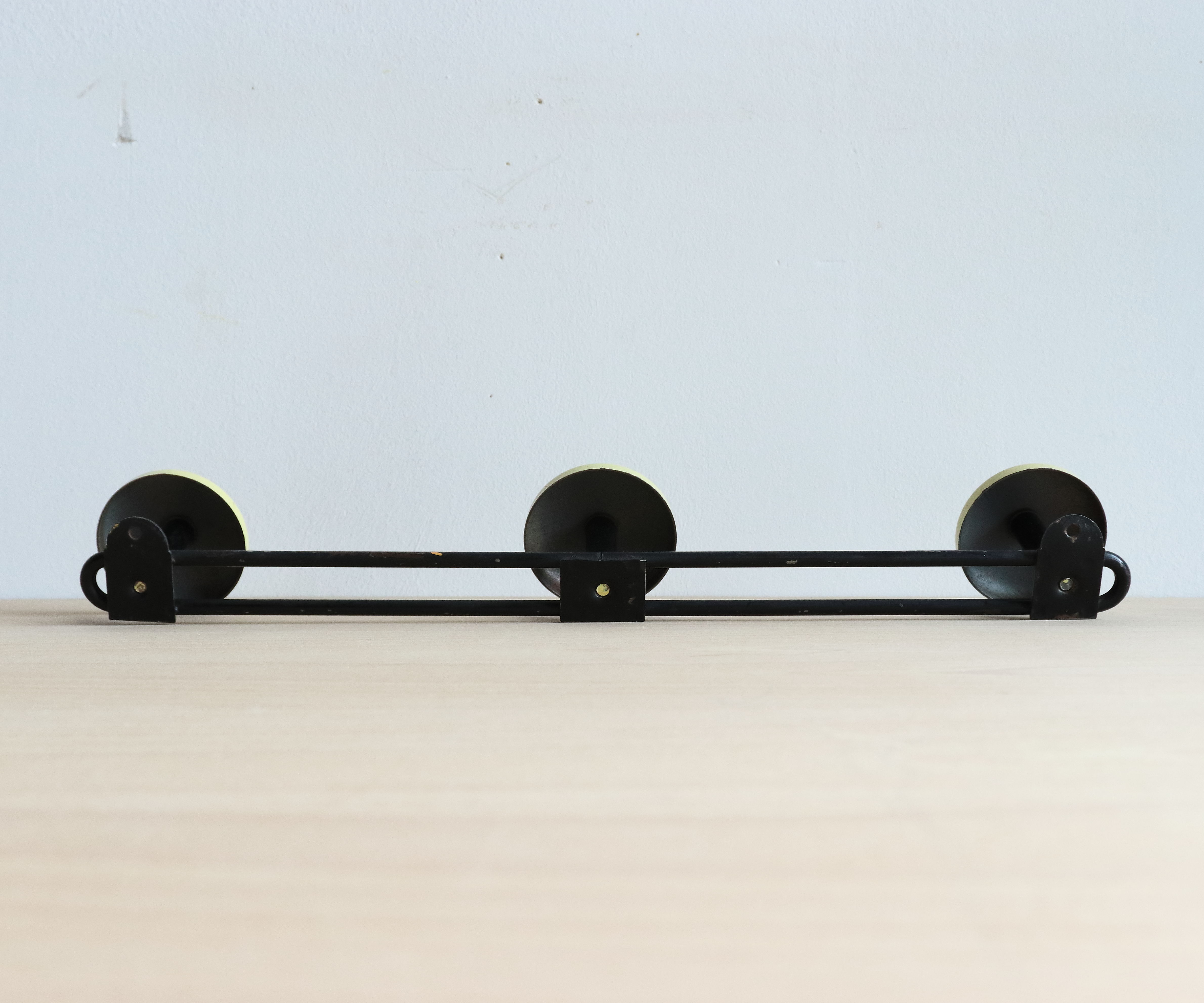 Wall doorpiece three black metal and yellow sheet metal