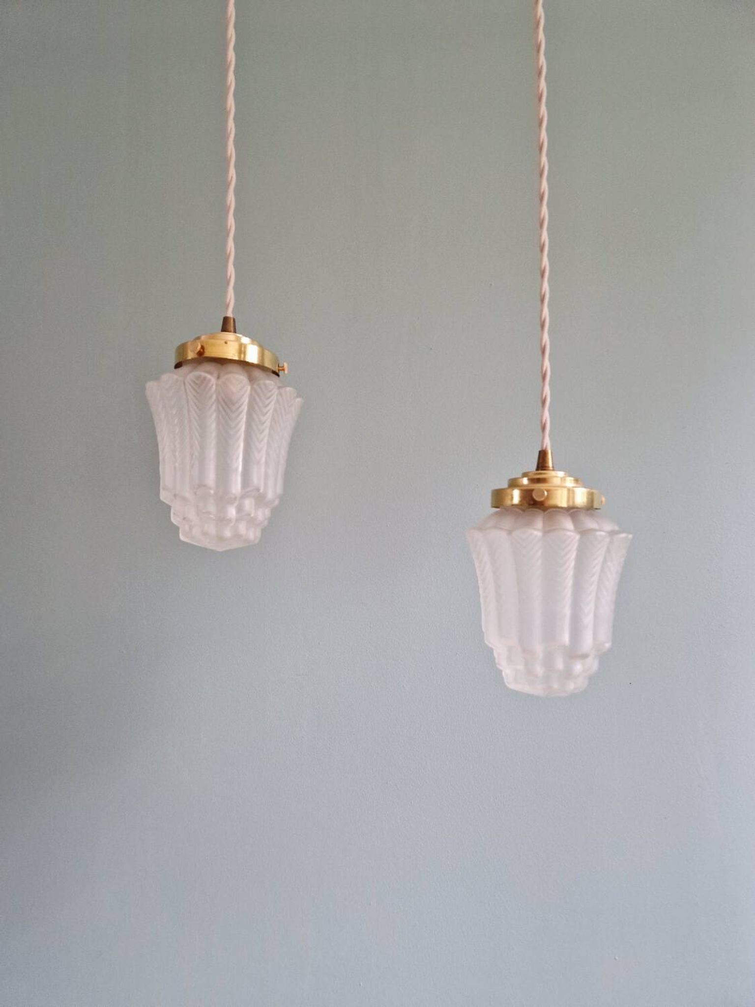 Pair of Art Deco Skyscraper-style pendant lights in frosted glass, 1920-30