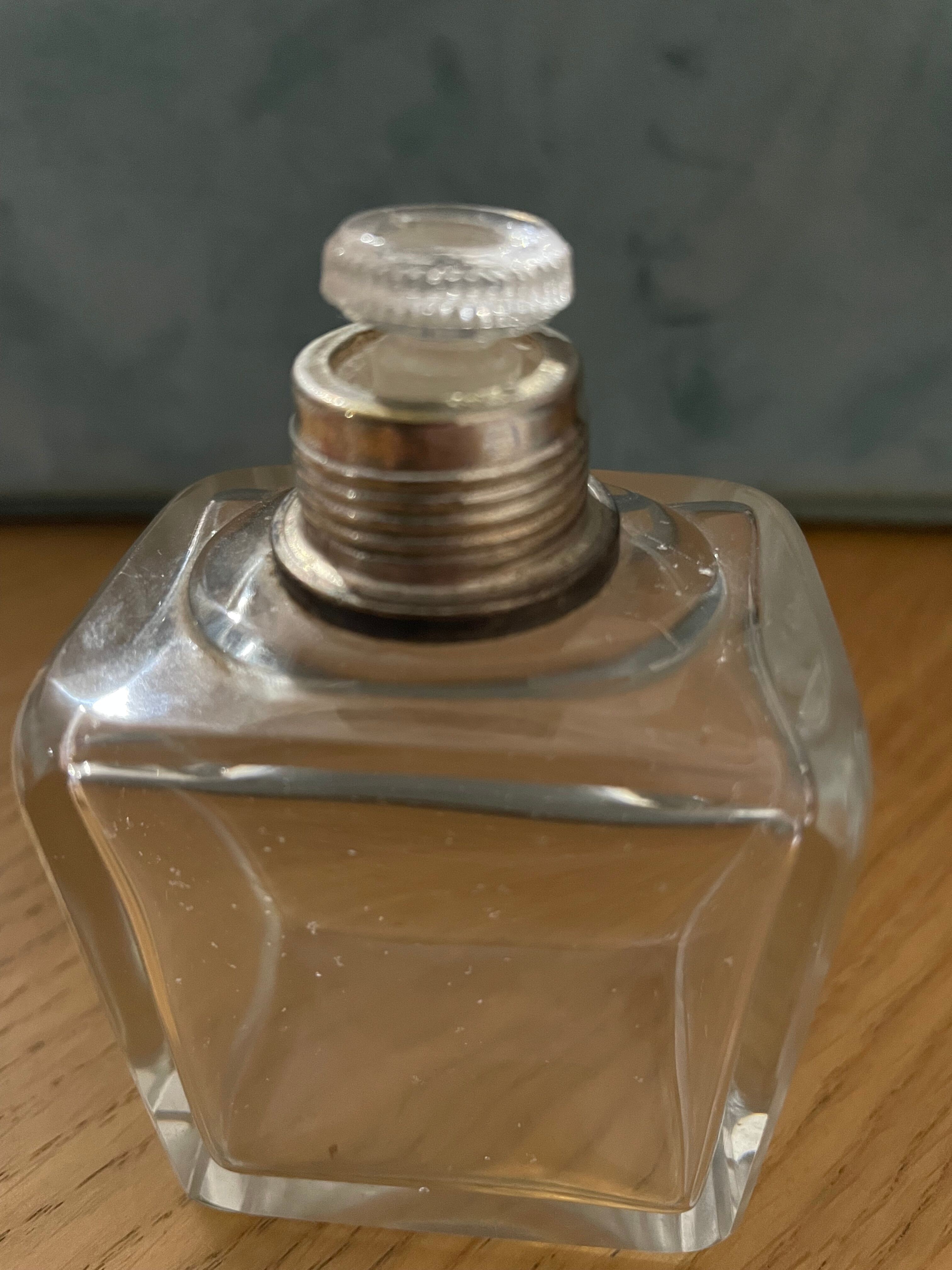 Old perfume bottle silver metal cap
