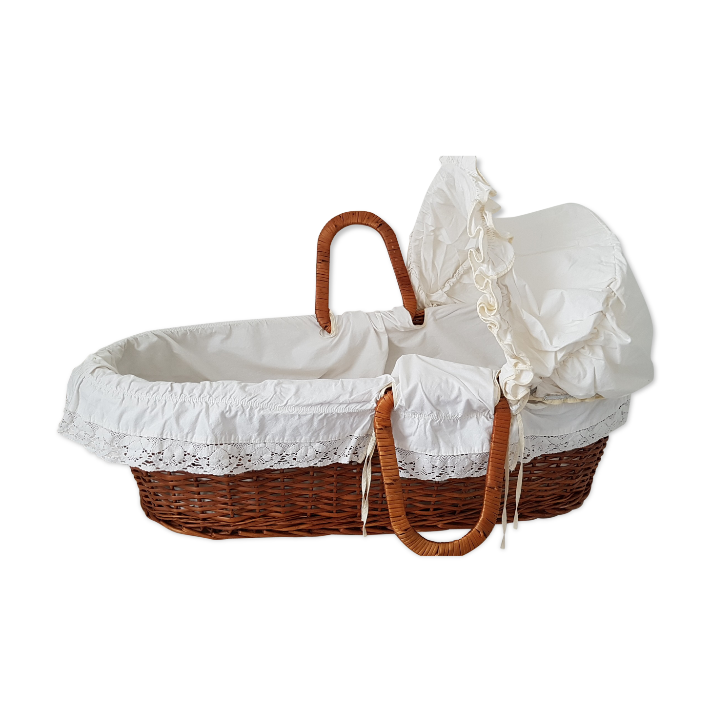 Old rattan bassinet and bedding