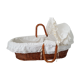 Old rattan bassinet and bedding