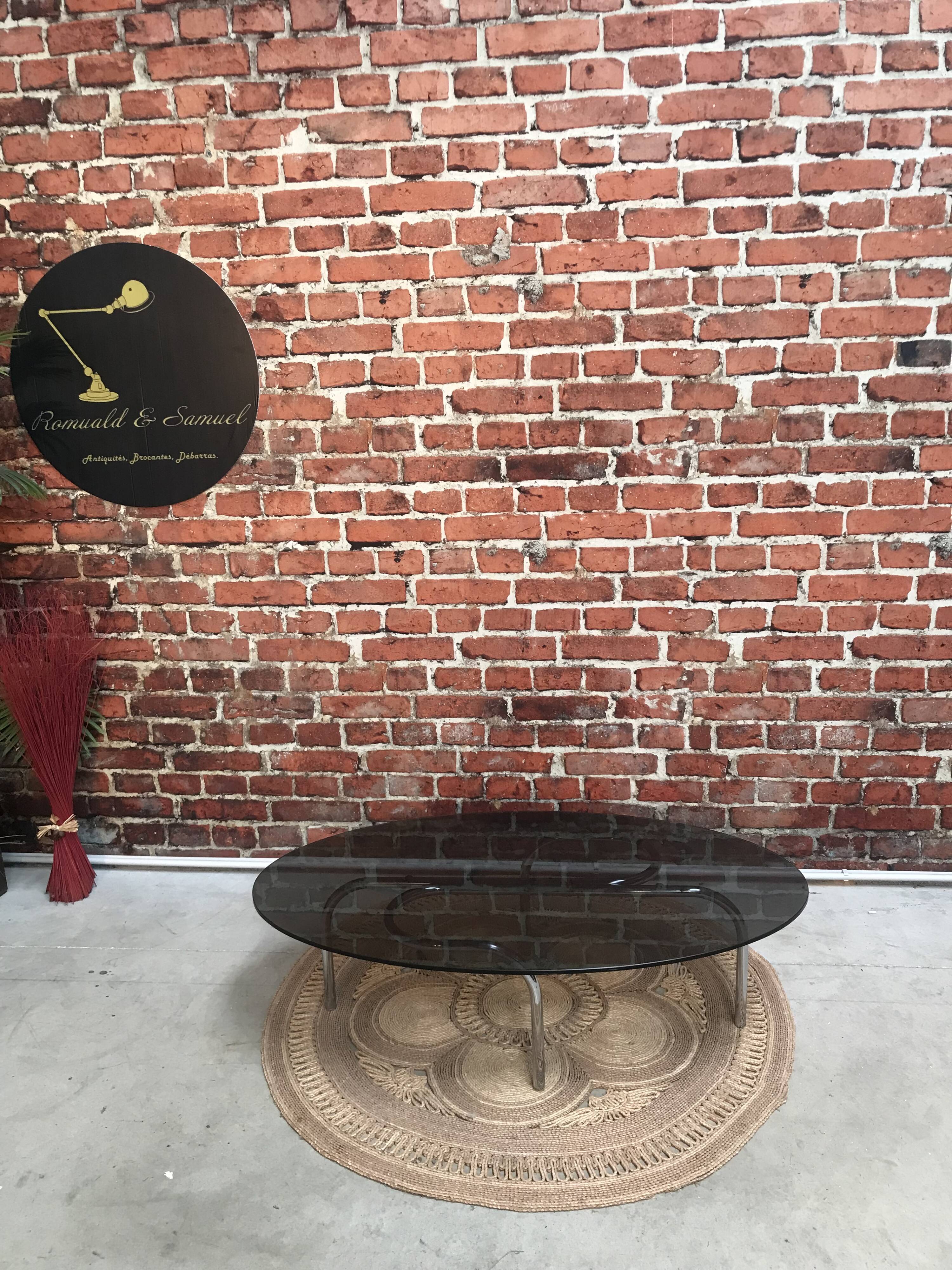 Vintage 70's oval coffee table in glass and chrome