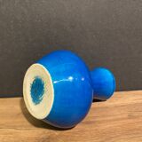 Signed vase in turquoise blue earthenware