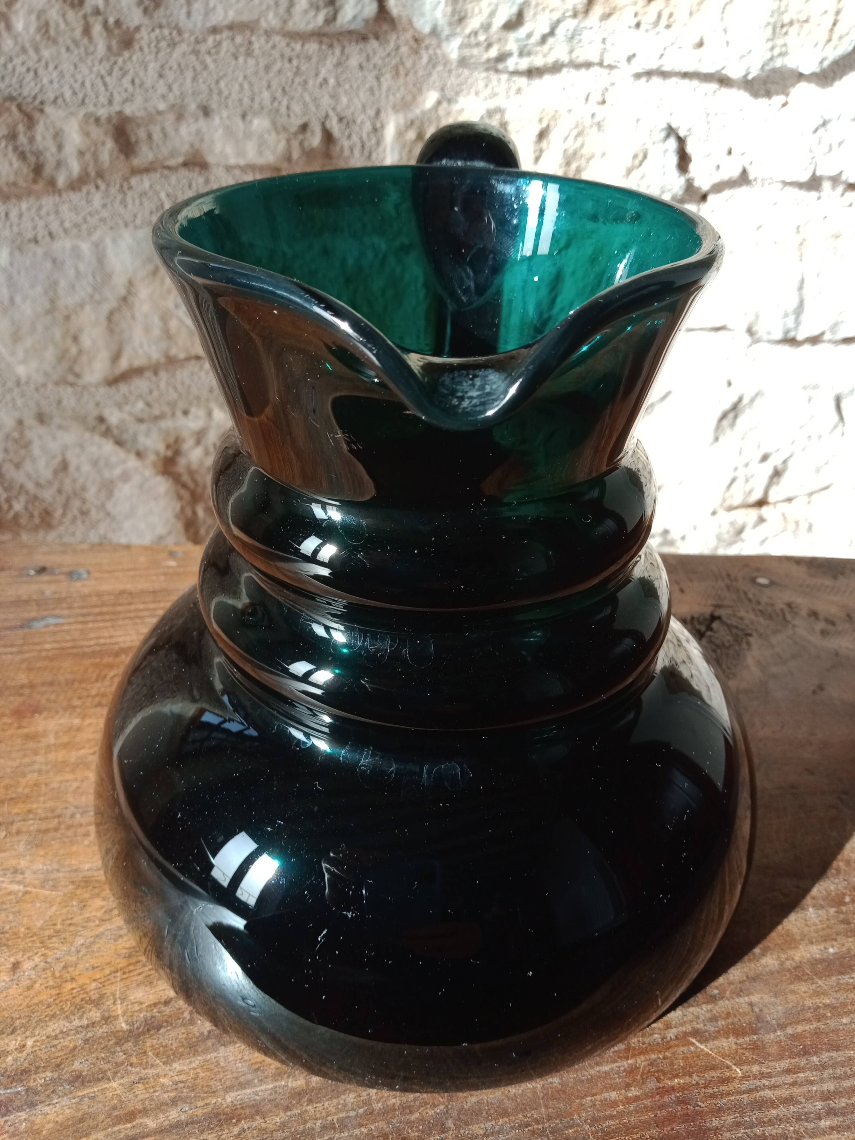 Deep green jug or pitcher with modern design - thick glass