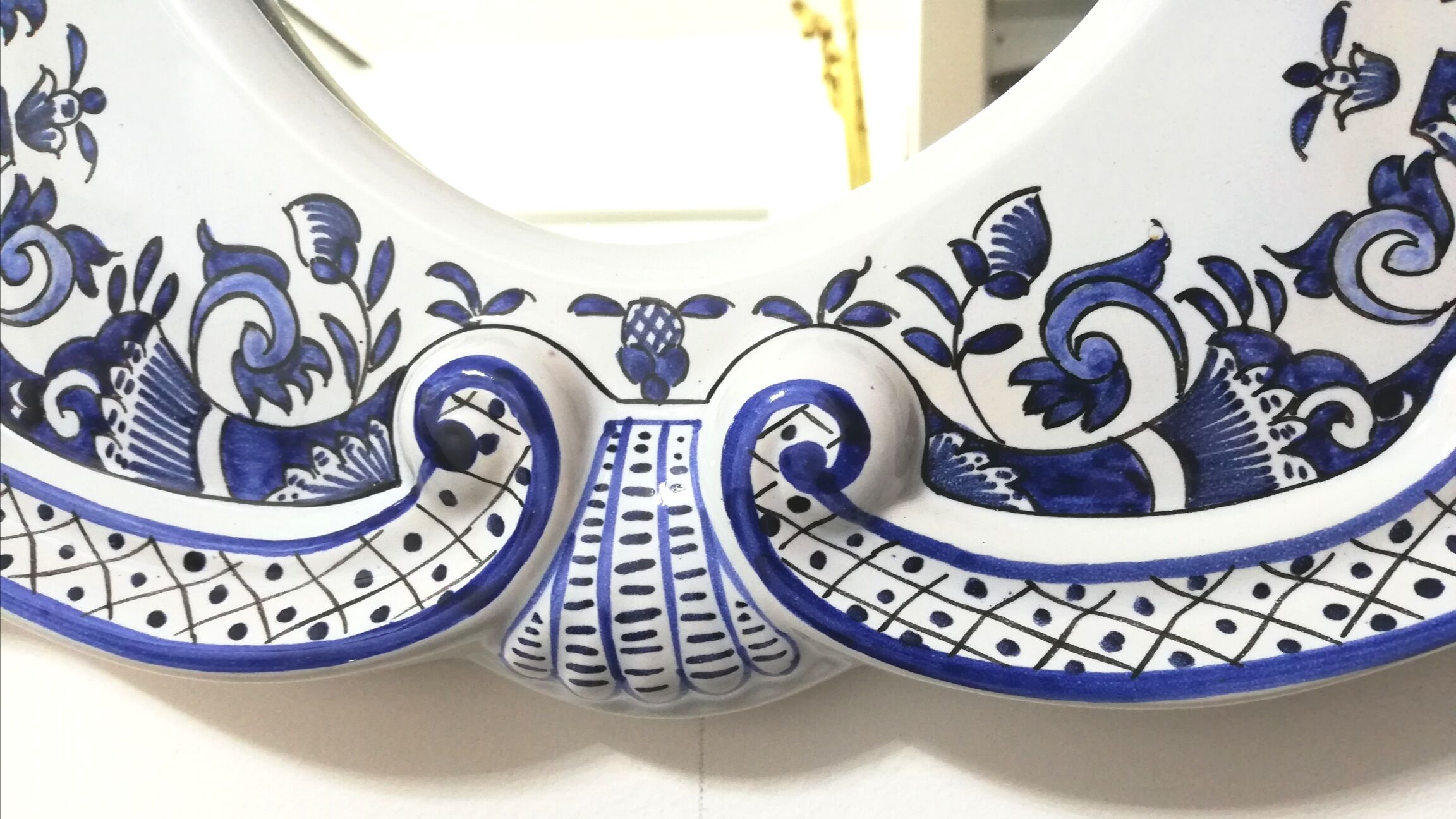 Mirror in old Rouen earthenware