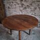 French antique round dining table in walnut, circa 1880–1900.