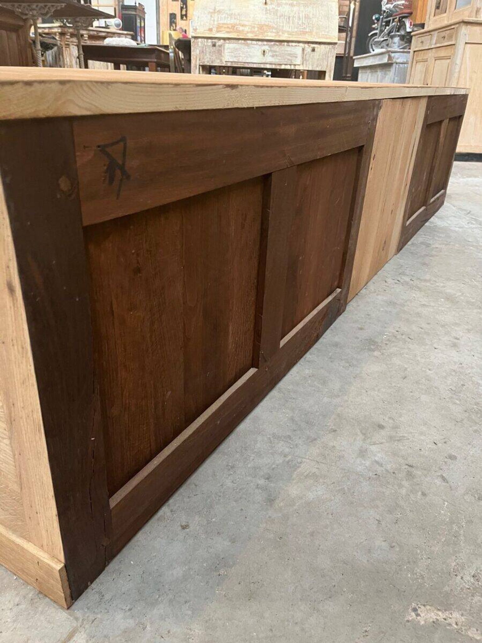 An old piece of workshop furniture transformed into a TV stand