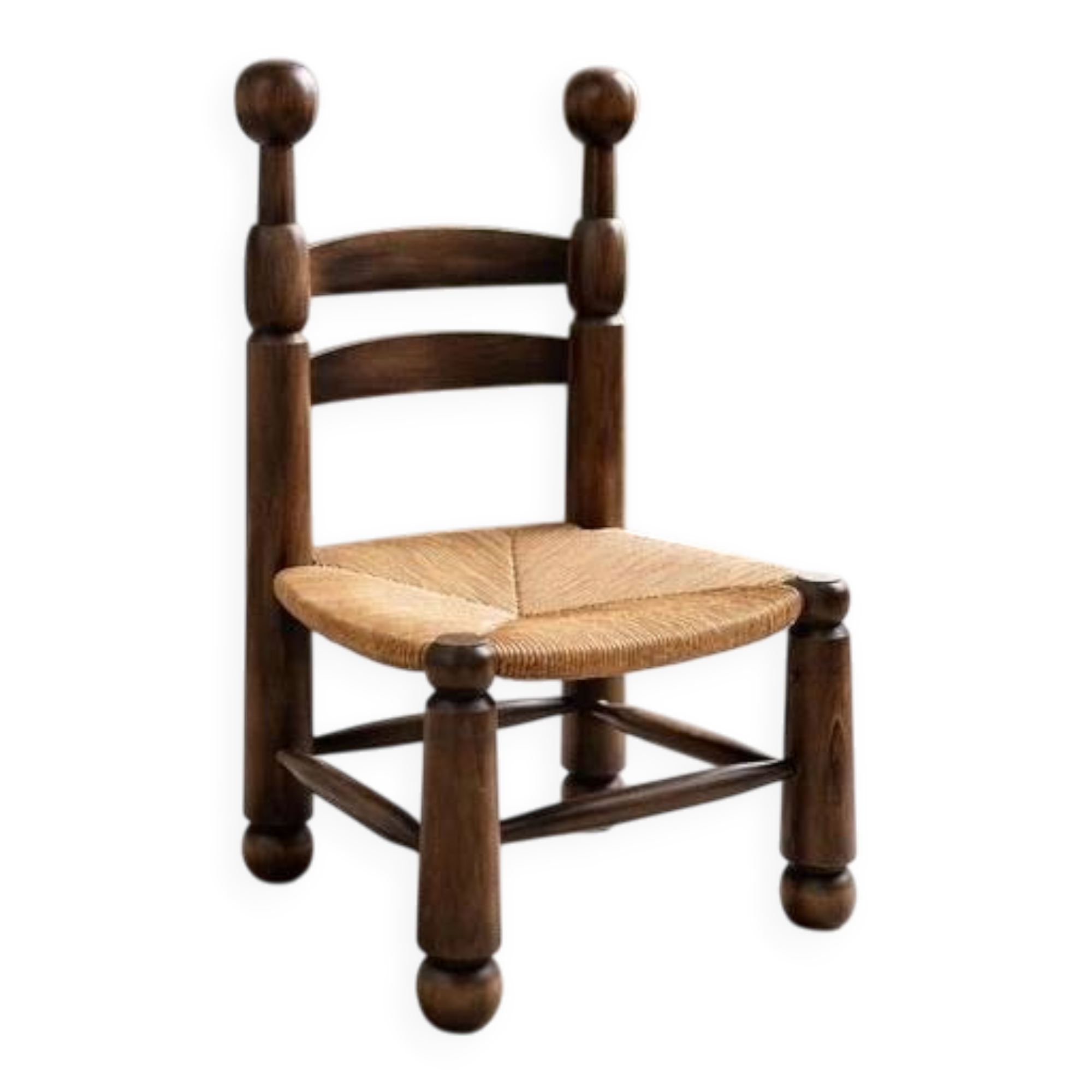Low fireplace chair in the style of Charles Dudouyt – wood and straw seat.