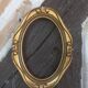 Stylized oval gold frame