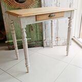 Antique wooden desk with a patinated base