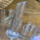 Knife rests, flower vases and candle holders in blown glass.