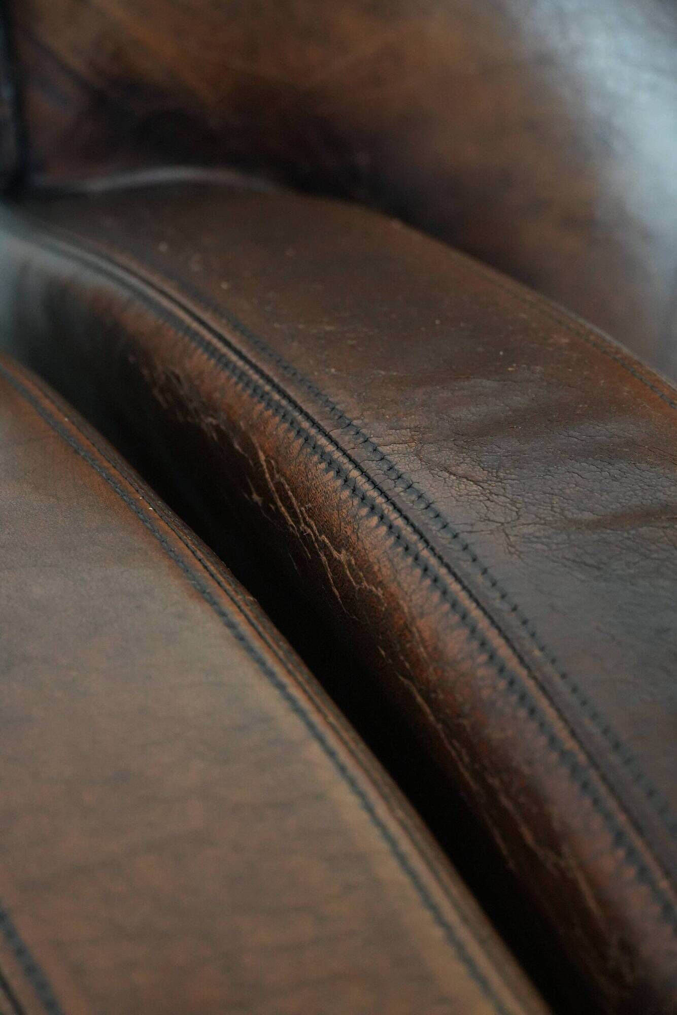 Characterful set of two vintage sheepskin armchairs with beautiful colours