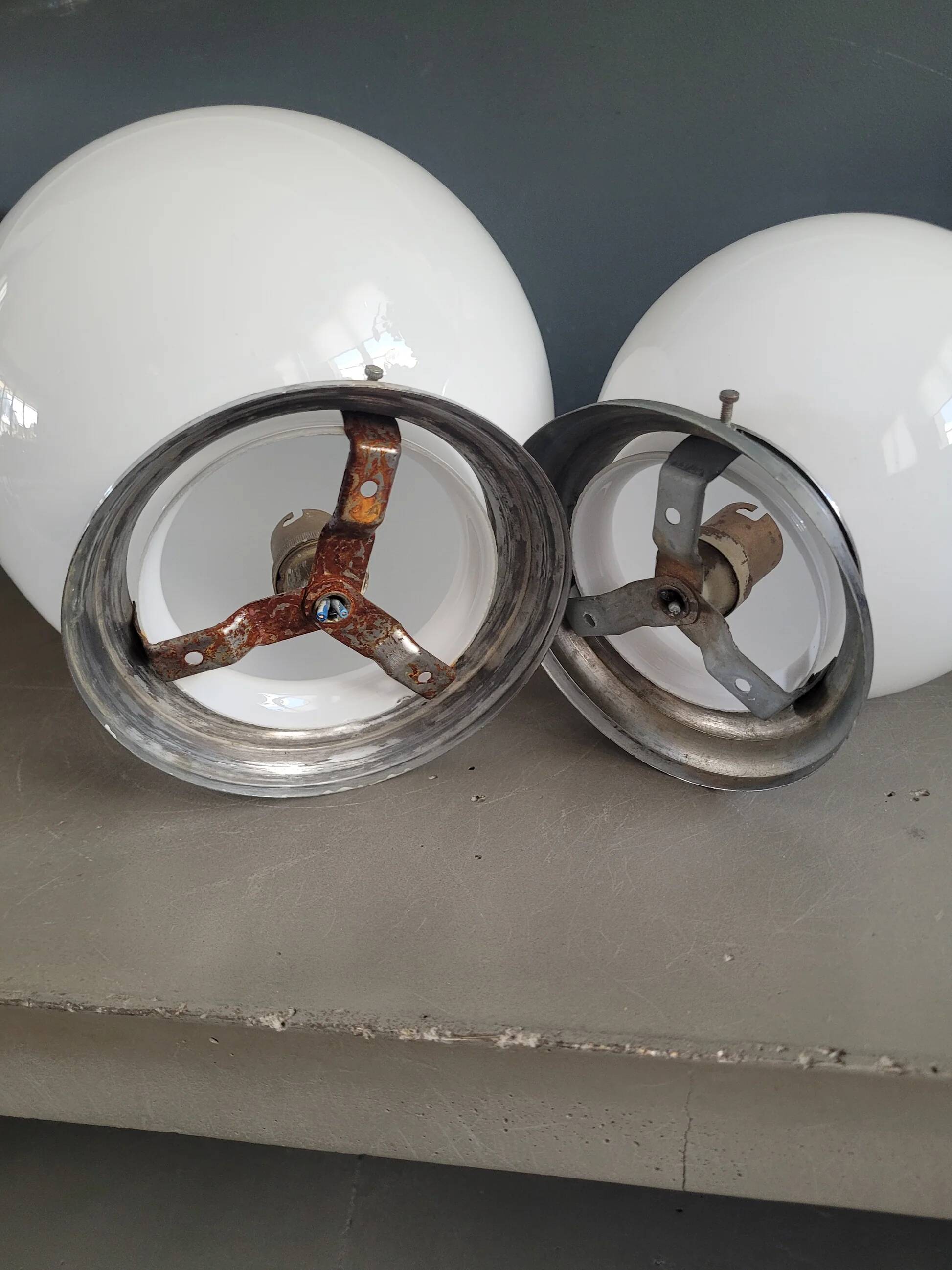 Pair of ceiling lights or wall lights with white glass globes.