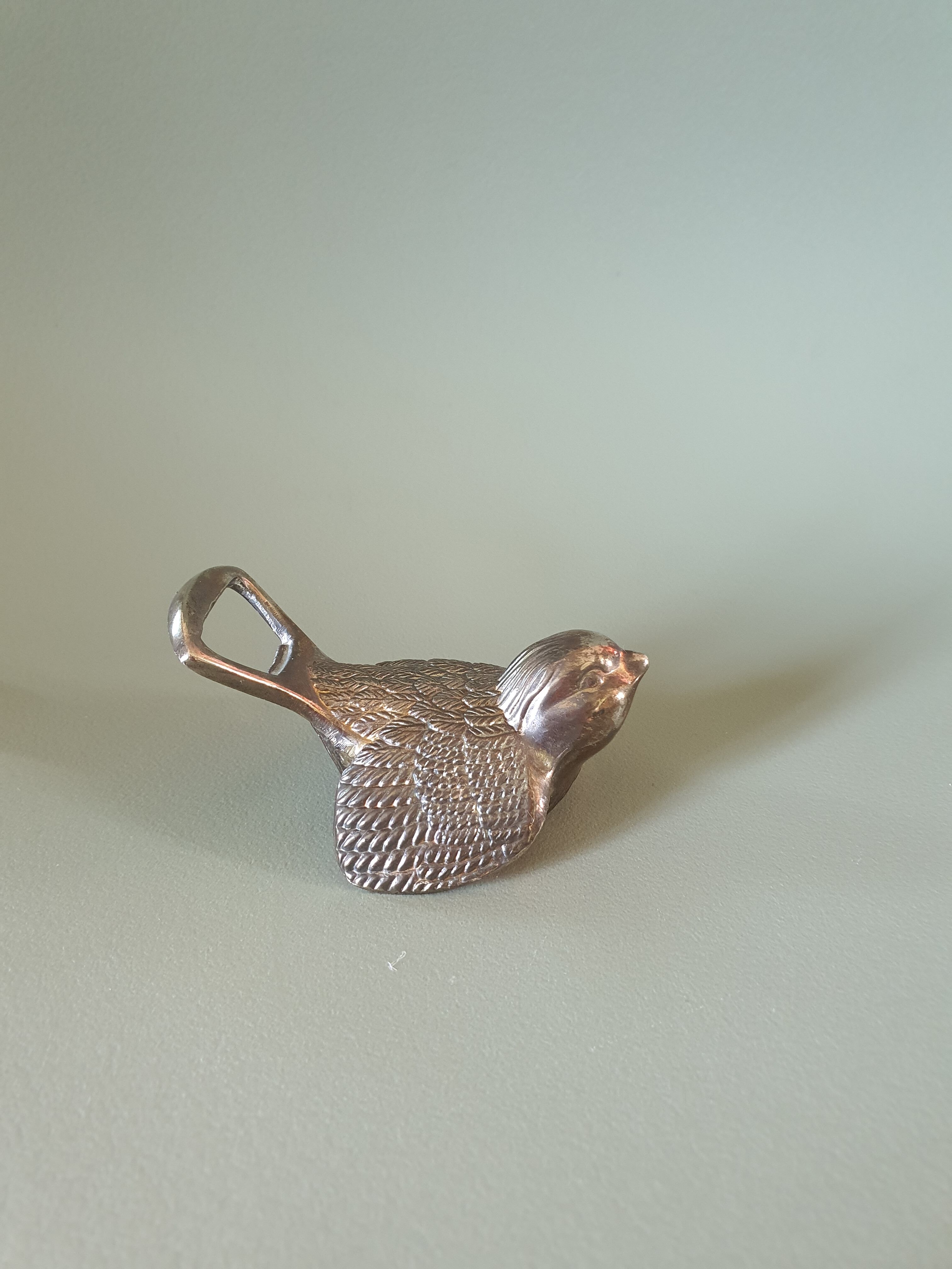 Vintage metal bird bottle opener