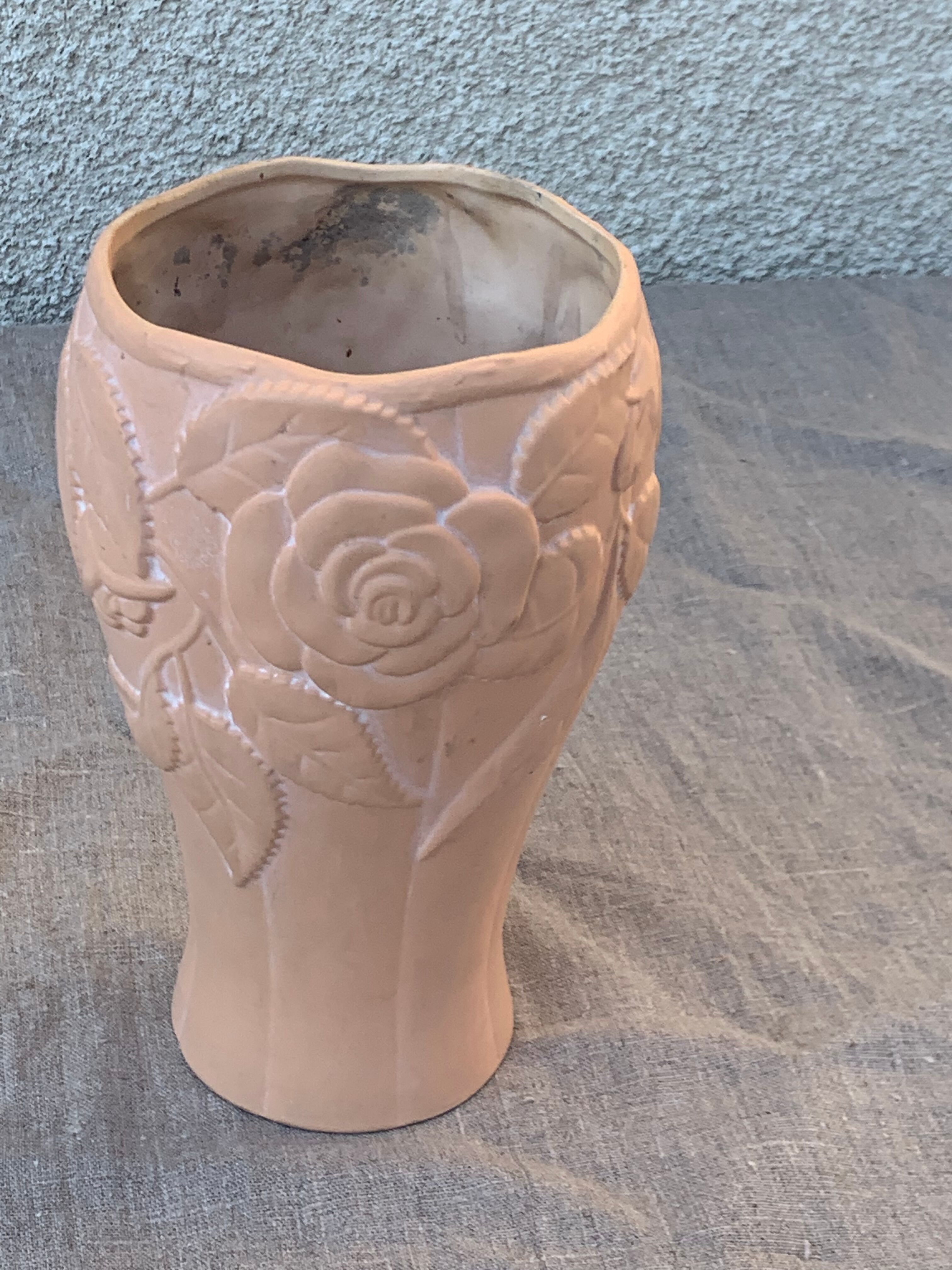 Terracotta vase with a vintage ceramic relief rose pattern