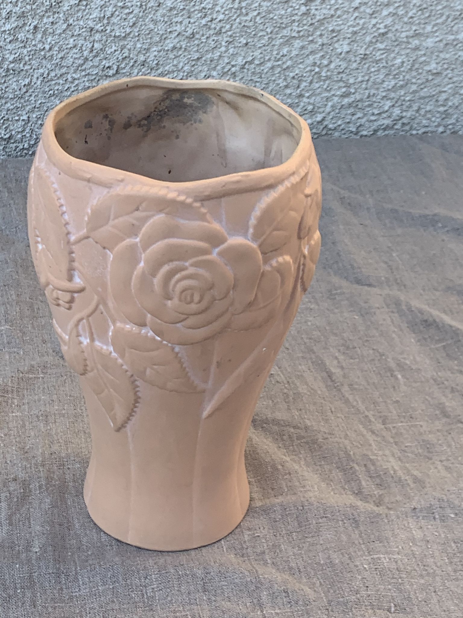 Terracotta vase with a vintage ceramic relief rose pattern