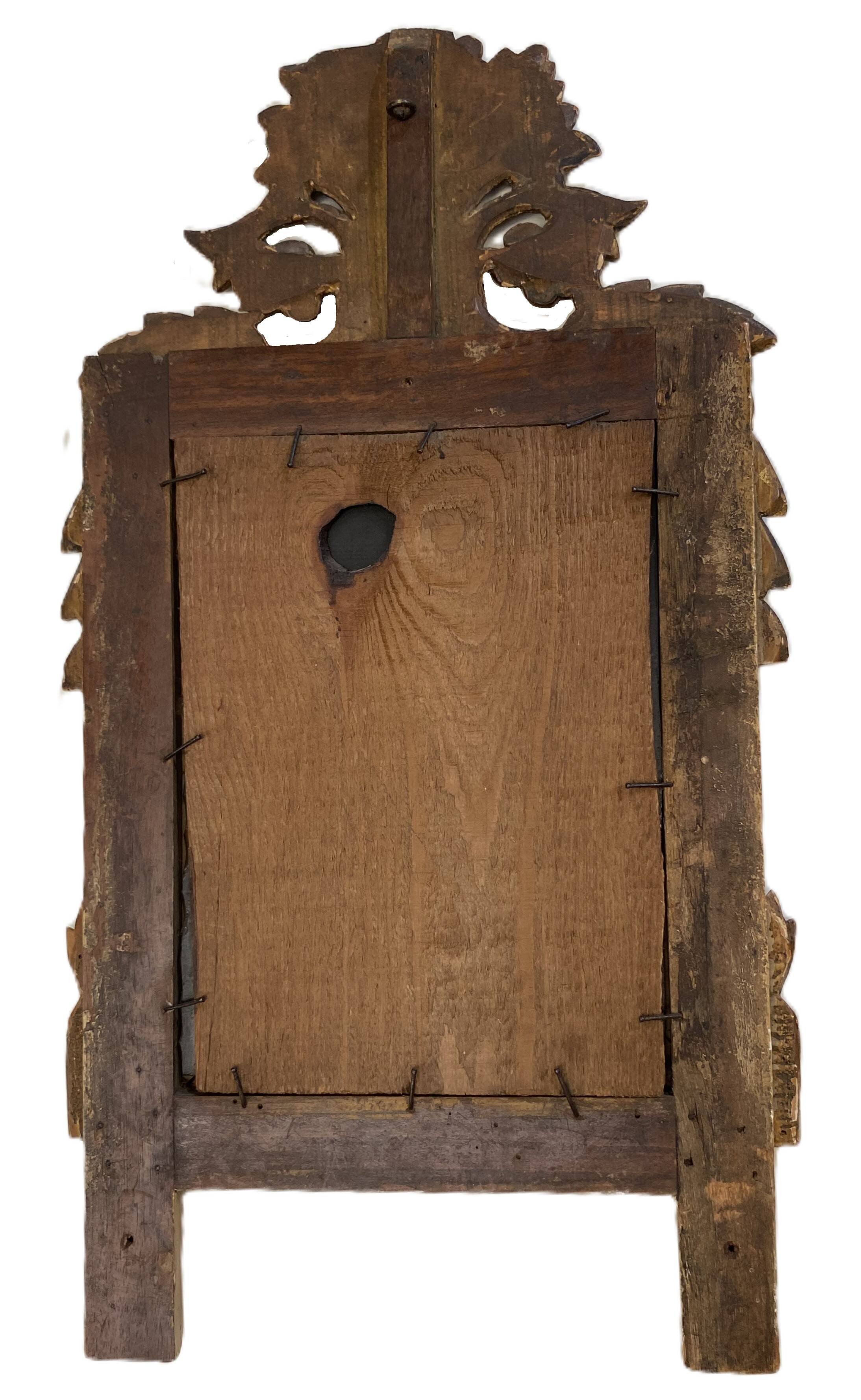 Petit miroir de dame Louis XVI en bois sculpté et doré