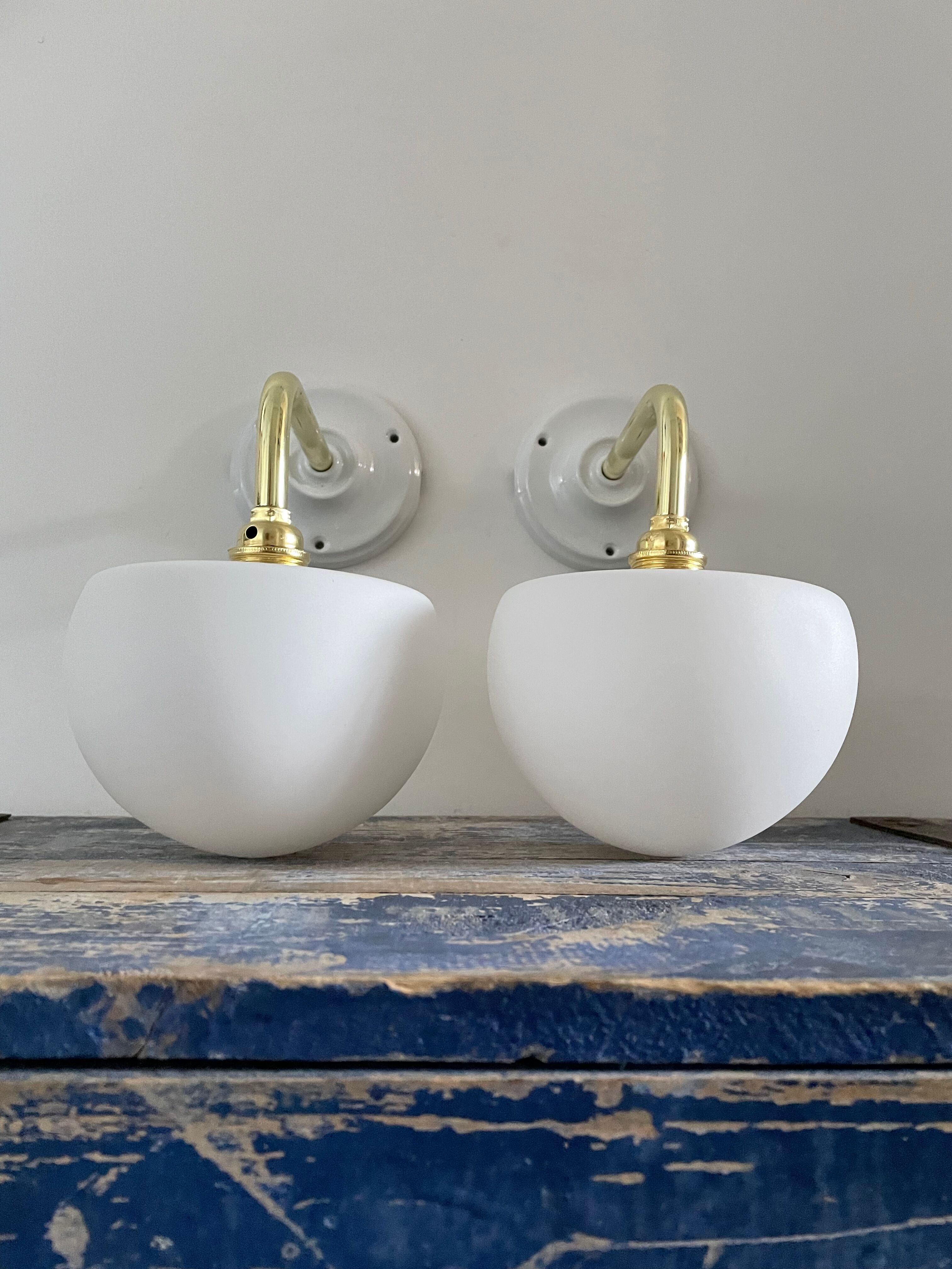 Set of two electrified white opaline wall lamps to nine