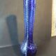 Vintage cobalt blue glass vase with foliage decoration.