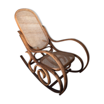 Rocking-chair with cane seating and backrest.