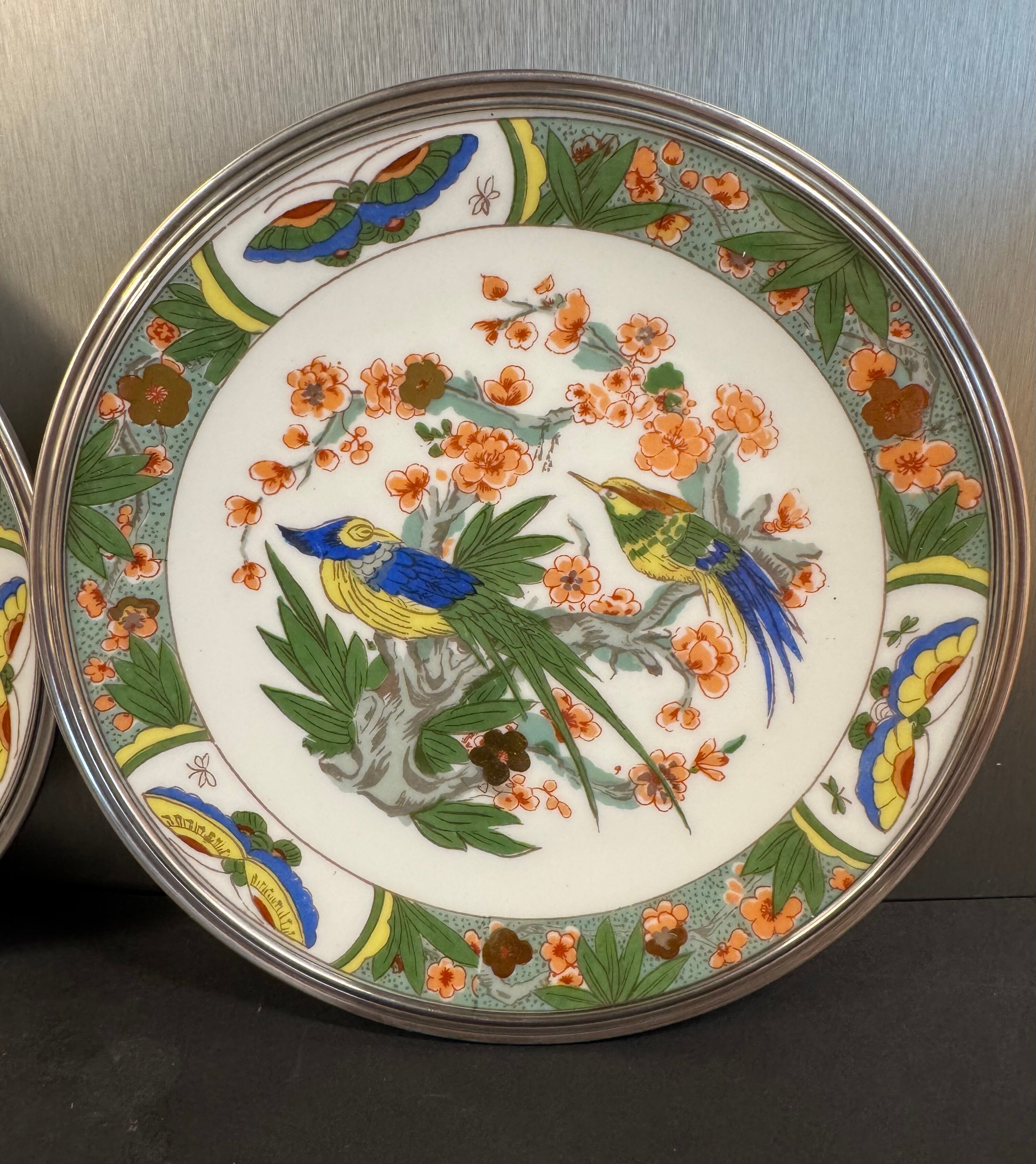 Two Raynaud Limoges plates and Tetard brothers silver.