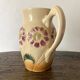 Flower-patterned earthenware pitcher