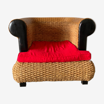 Rattan armchair and vegetable braiding