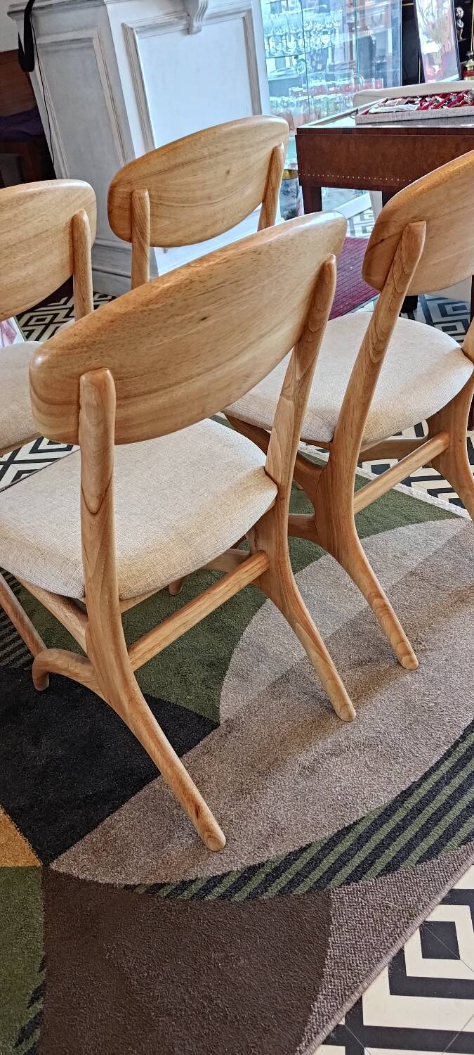 Four Scandinavian-style chairs