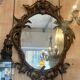 Large gilded wooden mirror, richly carved with winged dragons, 19th century