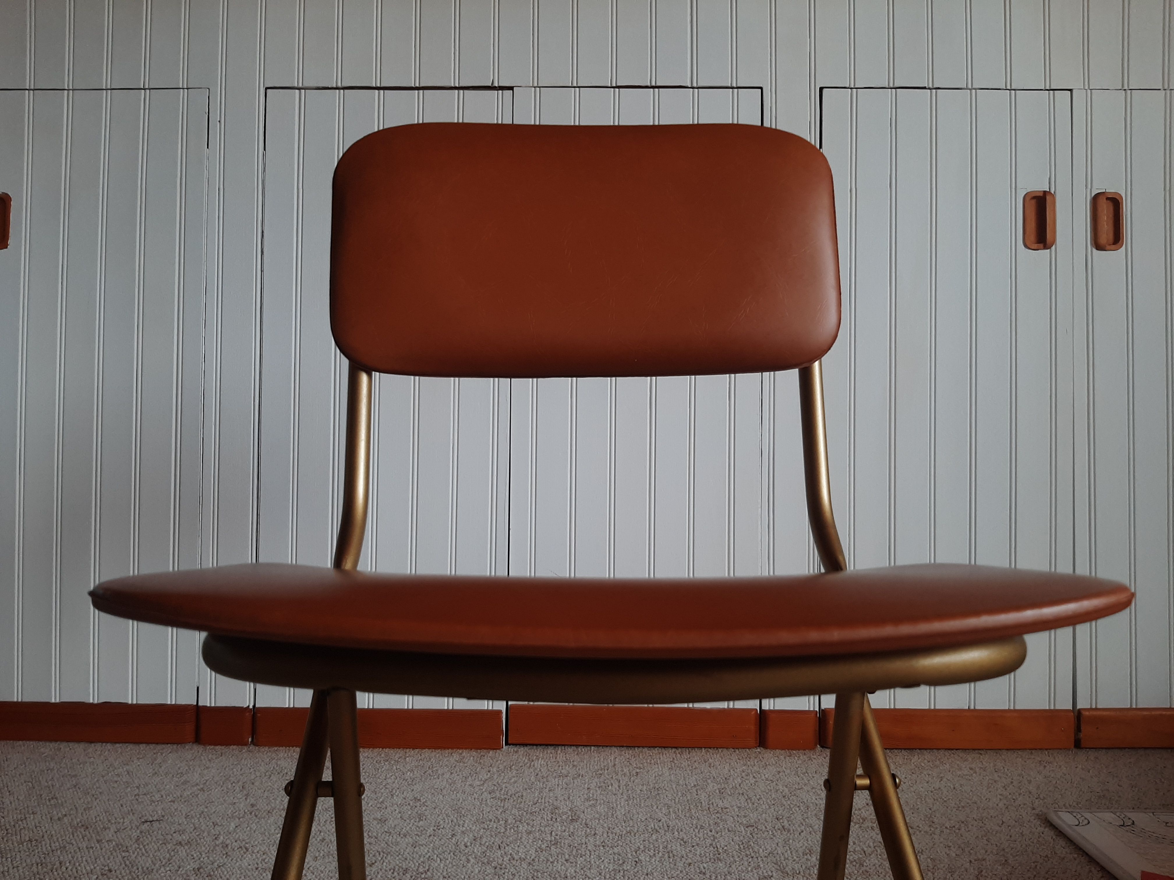 Chaise pliante structure tube et simili cuir