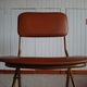 Chaise pliante structure tube et simili cuir