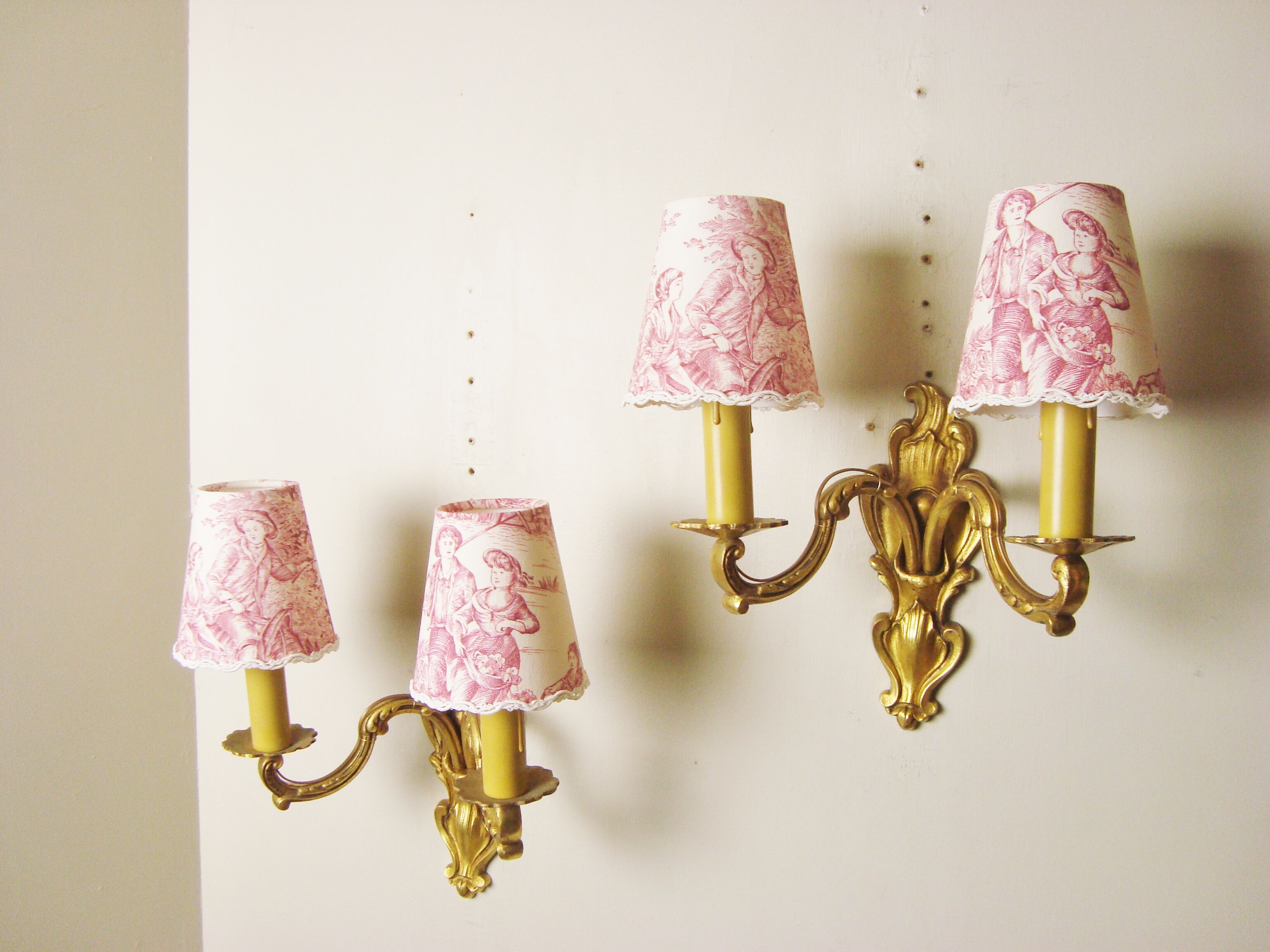 Pair of bronze sconces with four handmade toile de Jouy lampshades in France