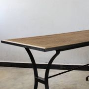Dining table in rattan and wrought iron similar to Audoux & Minet.