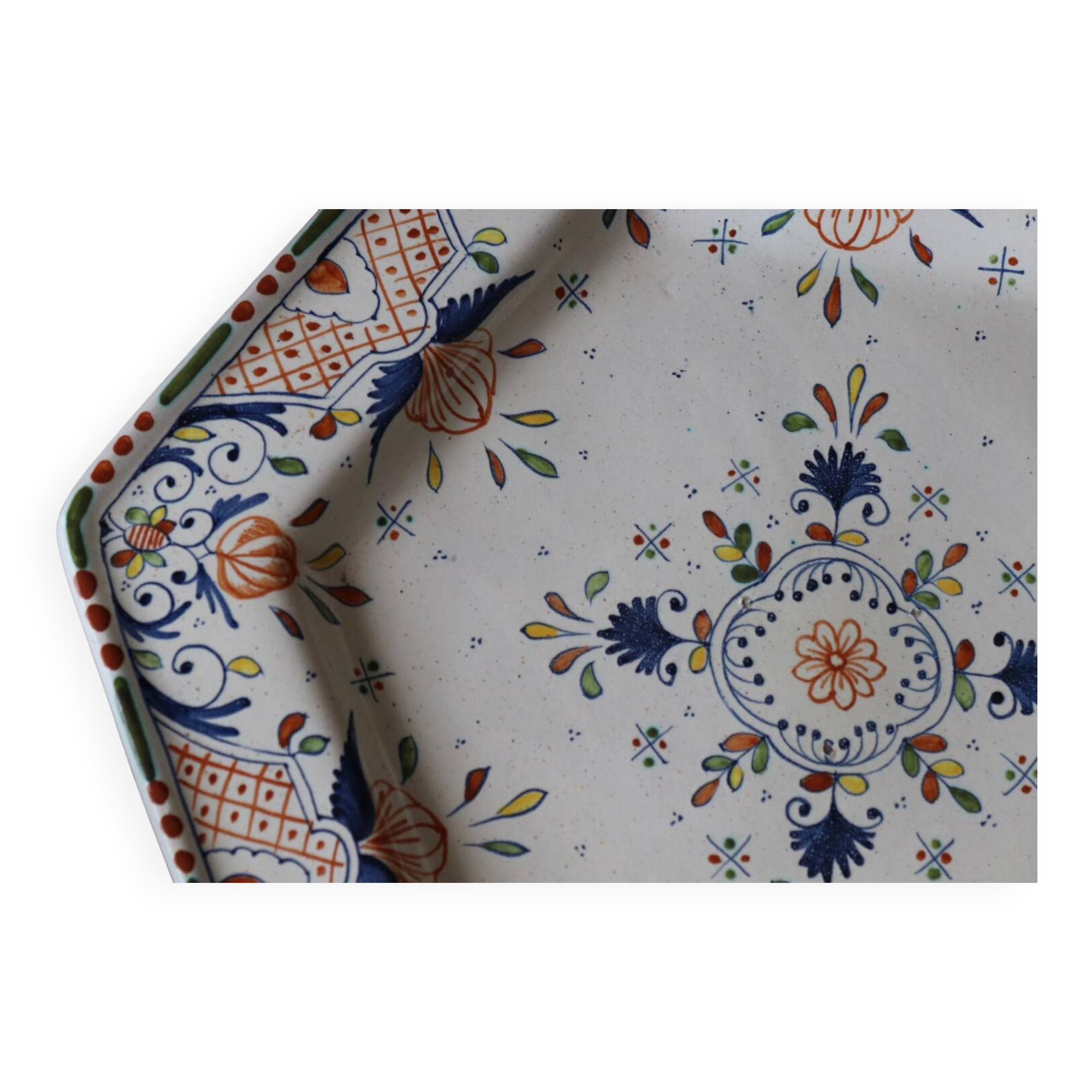 Ancient hexagonal plate in earthenware with polychrome floral decoration.