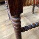 Corner armchair in beaded wood straw