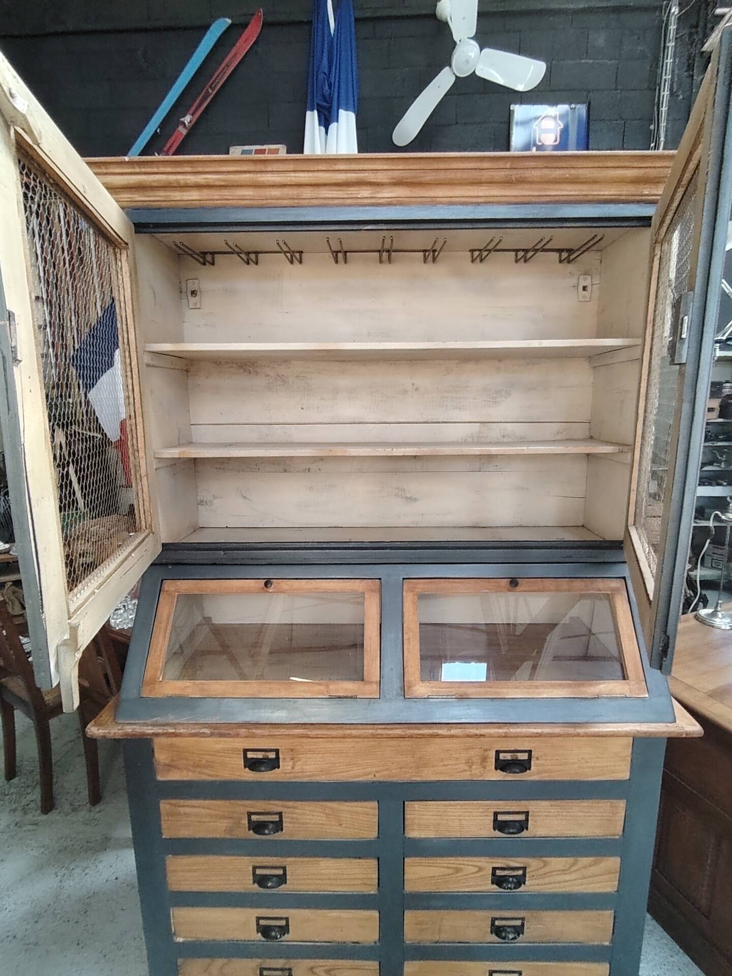 Large two-body grain merchant cabinet made of solid wood.