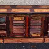 Furniture low in colorful wood. 12 drawers and 1 door
