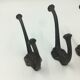 Set of 5 cast iron hooks early 20th