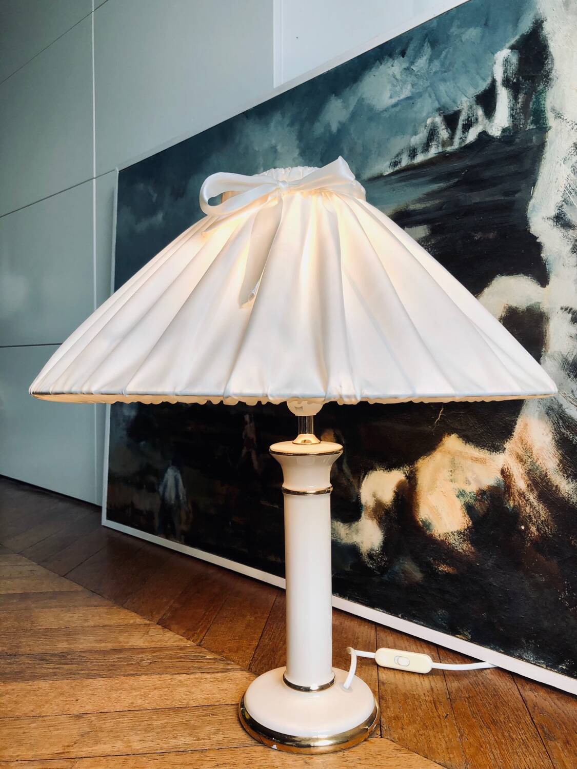 Vintage ivory ceramic lamp with gilding.