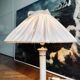 Vintage ivory ceramic lamp with gilding.