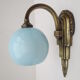 Applique art déco en laiton  et globe opaline bleu doux