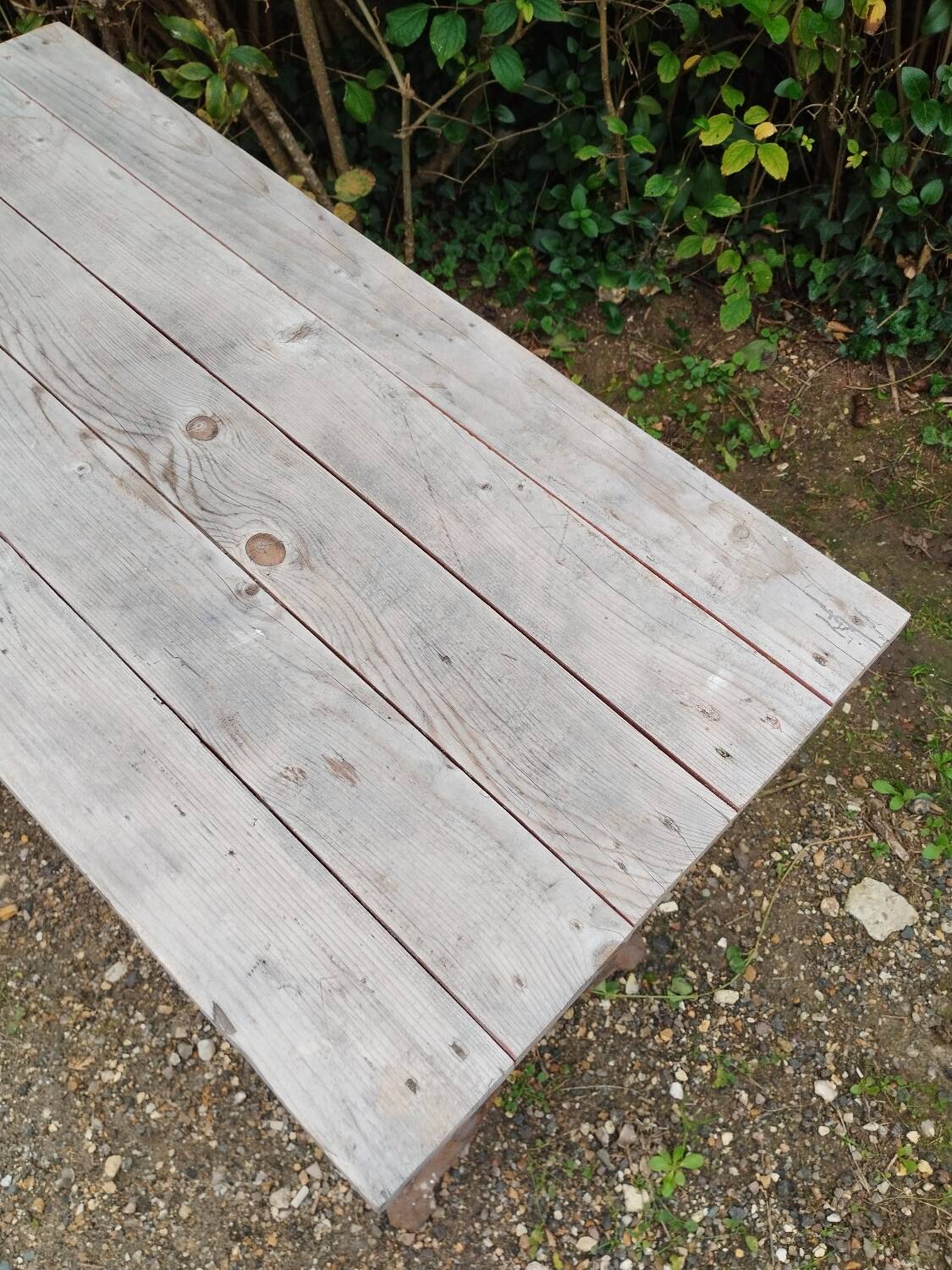 Antique bistro table with iron legs and wooden top