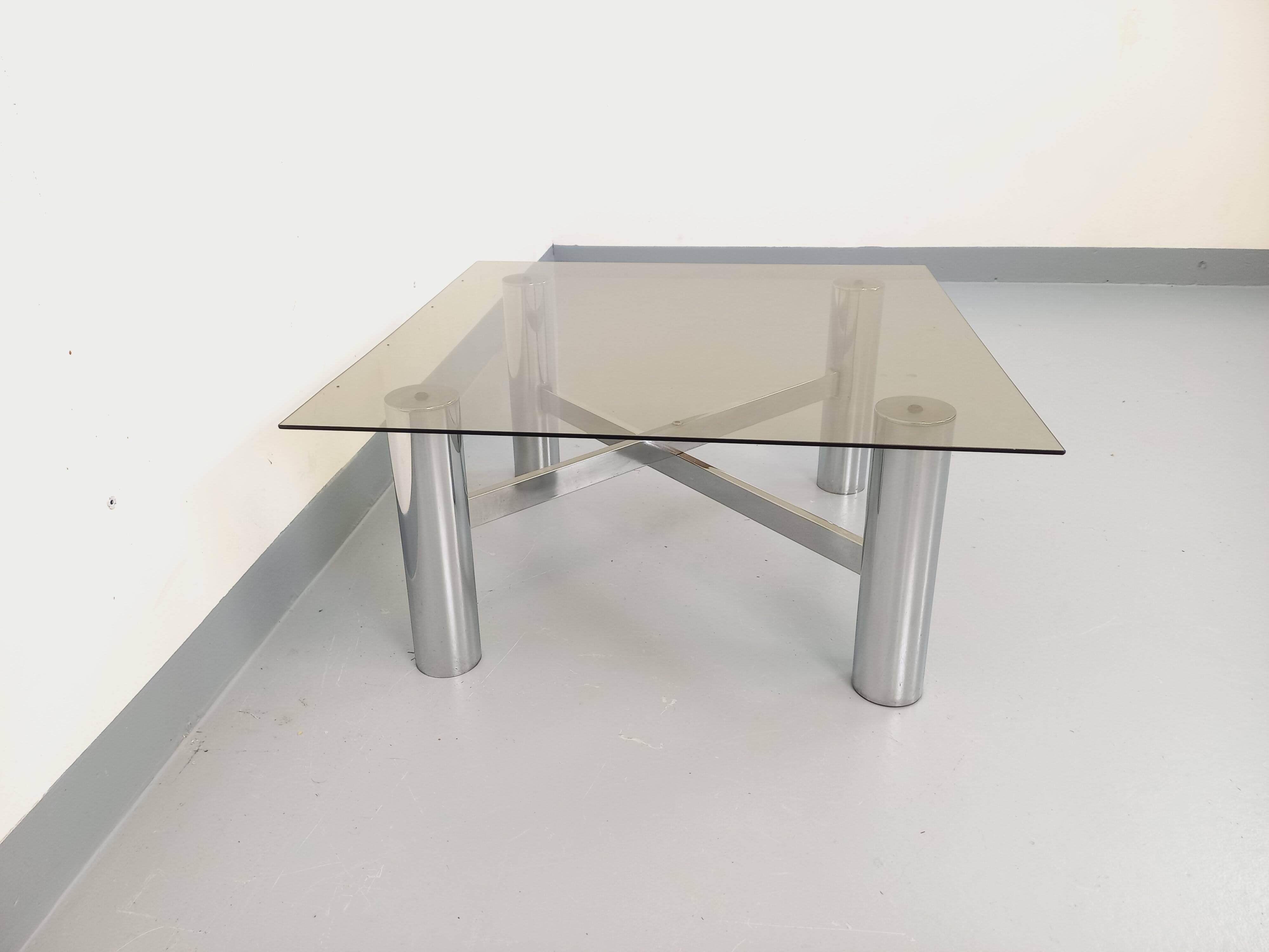 Square Italian vintage Space Age coffee table in smoked glass and metal.