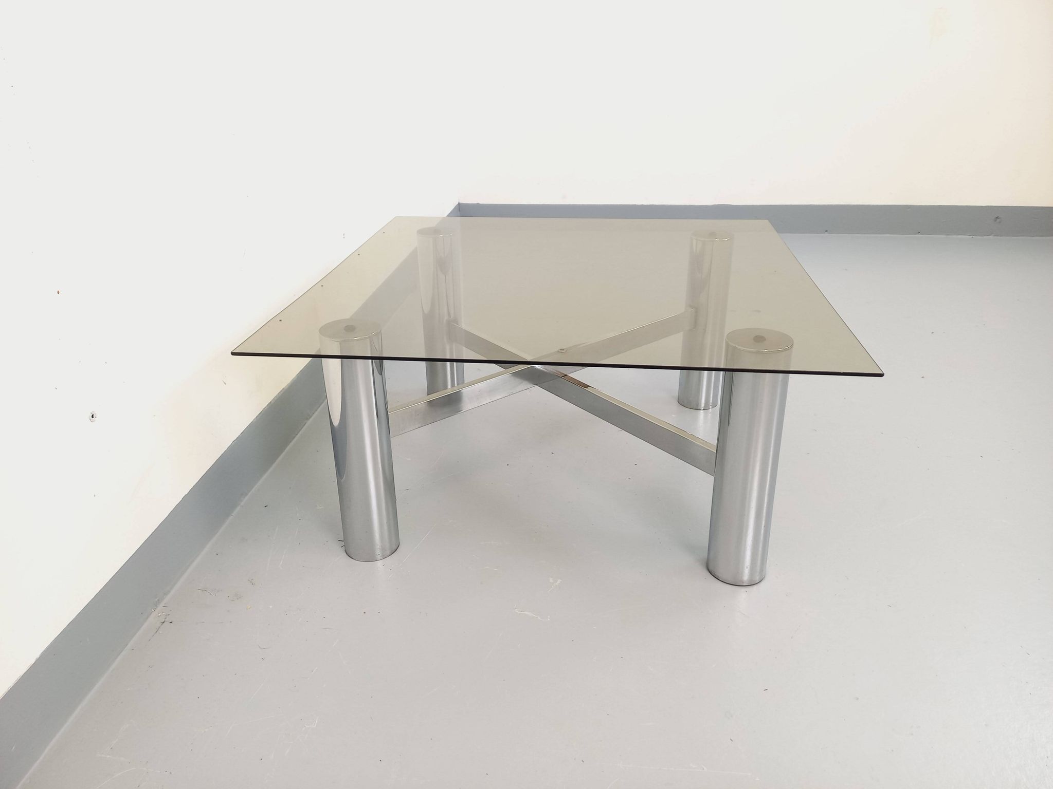 Square Italian vintage Space Age coffee table in smoked glass and metal.