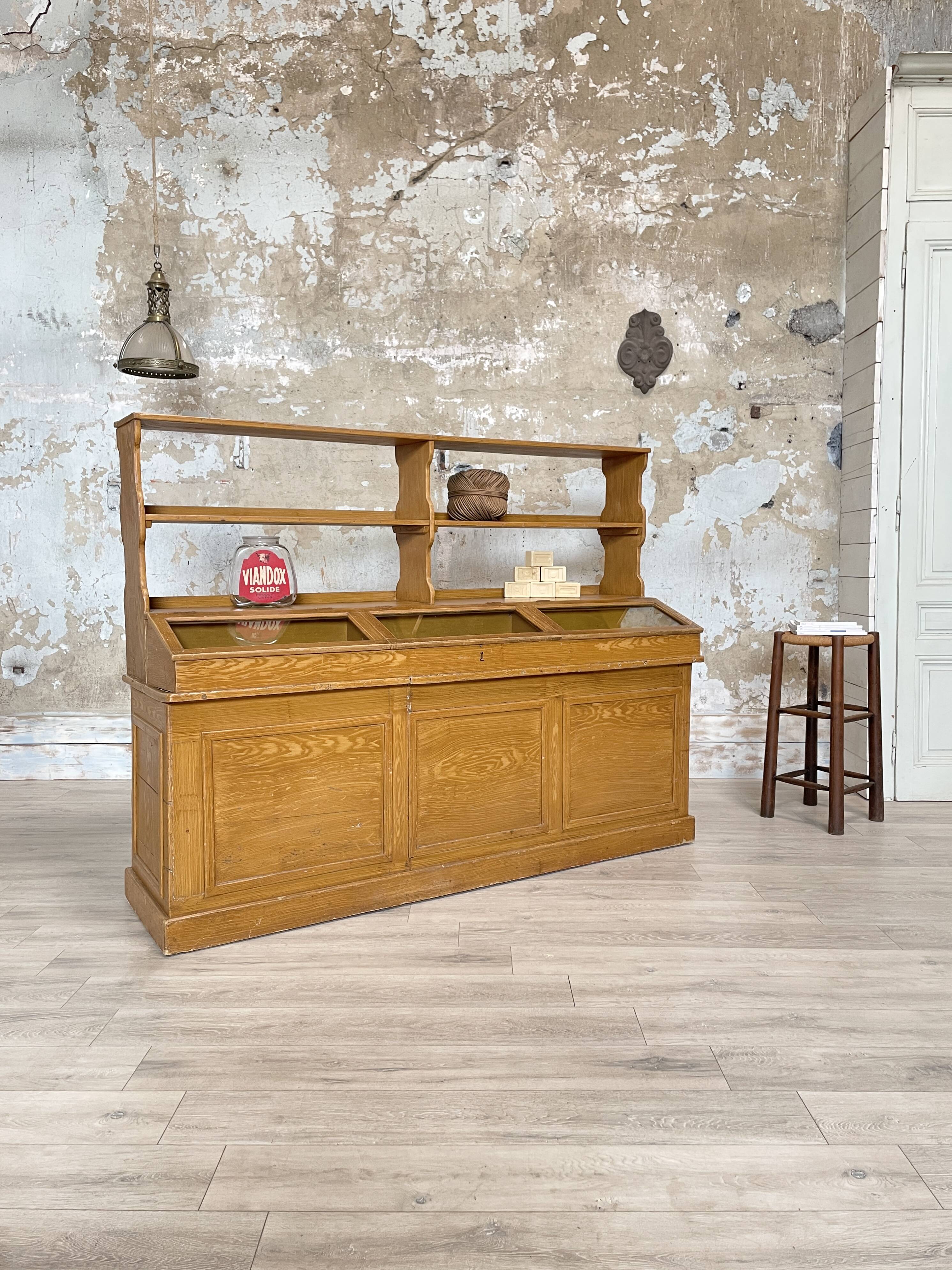 Wooden hardware cabinet painted with wood effect, circa 1940.