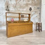 Wooden hardware cabinet painted with wood effect, circa 1940.