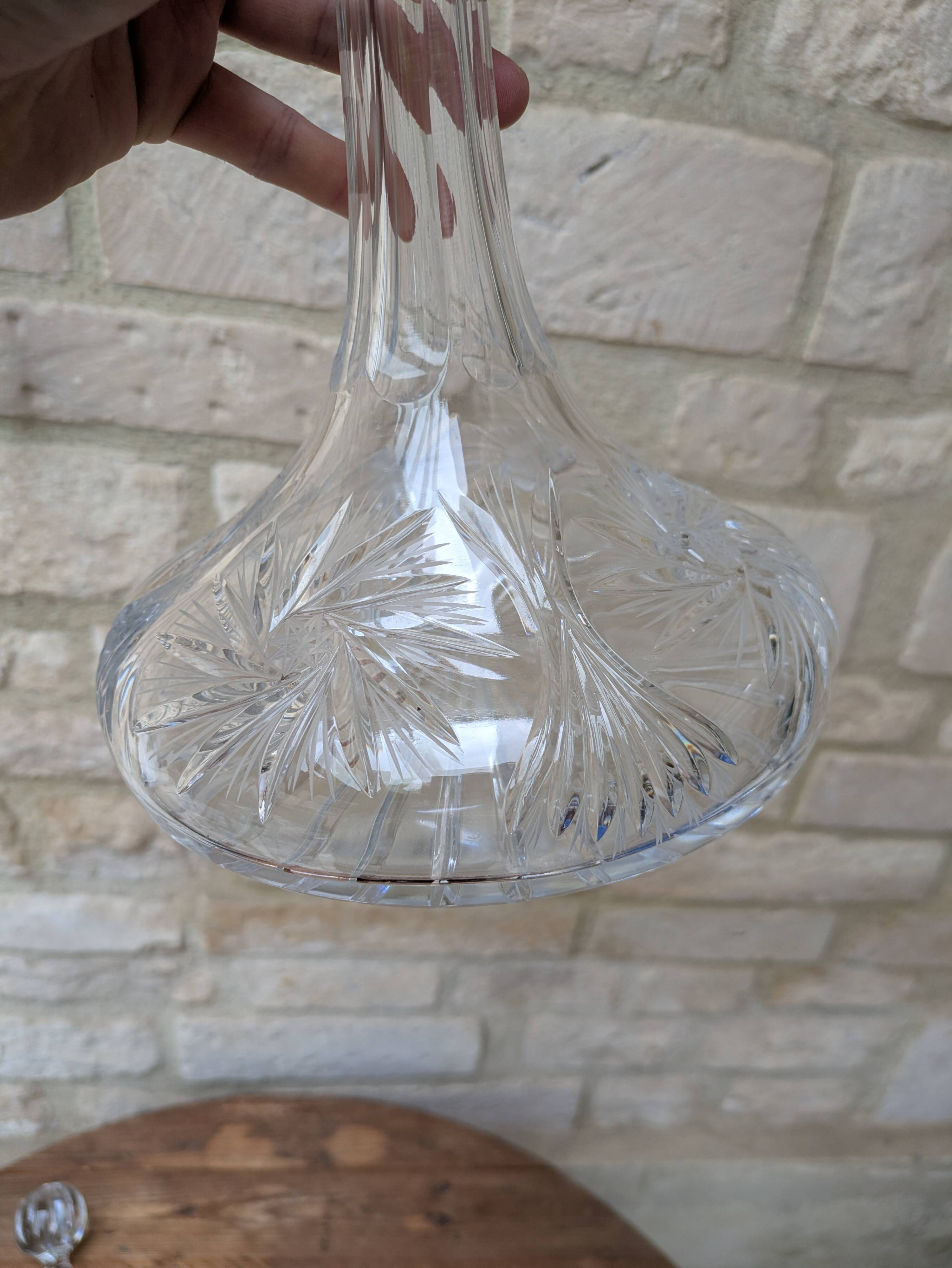 Antique cut crystal decanter with stopper.