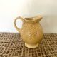Mustard yellow ceralic pitcher