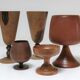 Five vintage turned wooden walking glasses