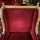 Golden wooden bergère in Louis XVI style upholstered in Bordeaux velvet.